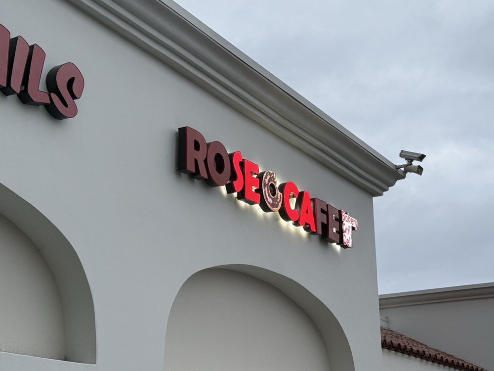 The red-lettered Rose Cafe sign, with a donut standing in for the O